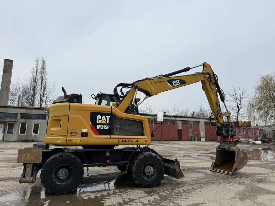 Caterpillar CAT M315 F  Koparka kołowa Caterpillar M315F z głowicą Rototilt, 3 łyżki, stan BDB