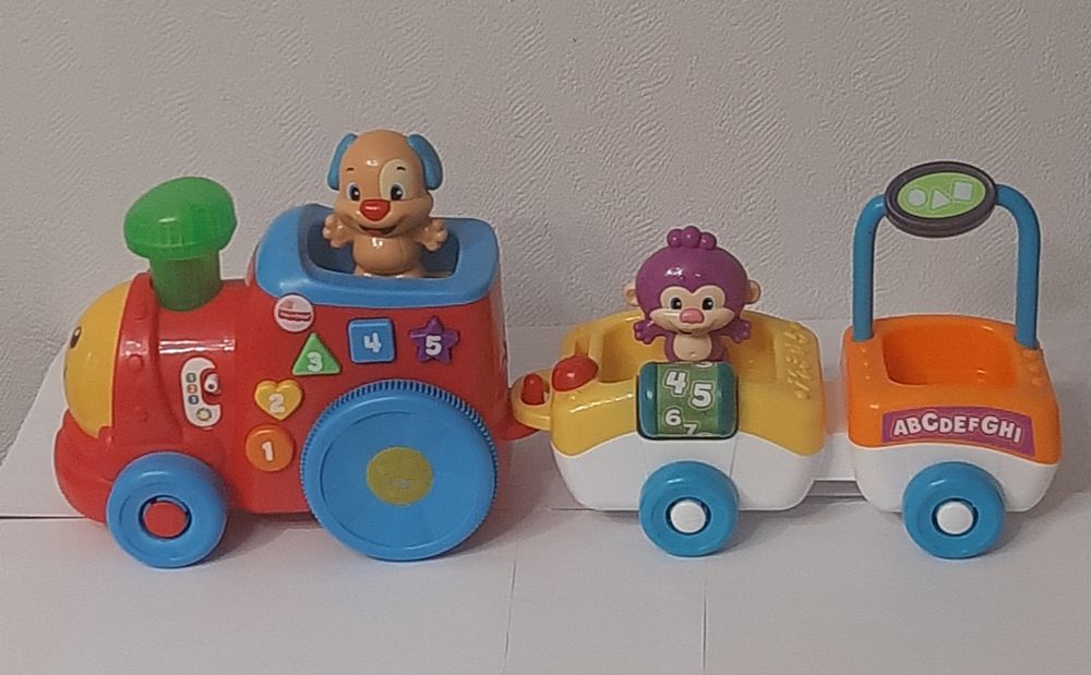 Развивающая игрушка "Поезд умного щенка" от бренда  Fisher Price