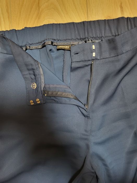 Nowe, materiałowe spodnie z szerokimi nogawkami i wysokim stanem