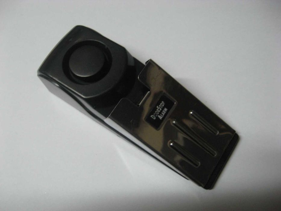 Travão de porta com alarme