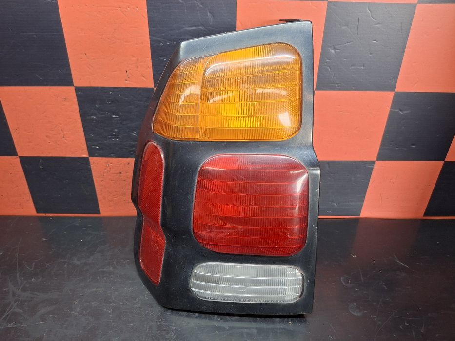 Farolim esquerdo MITSUBISHI Pajero Sport I (K7_, K9_)