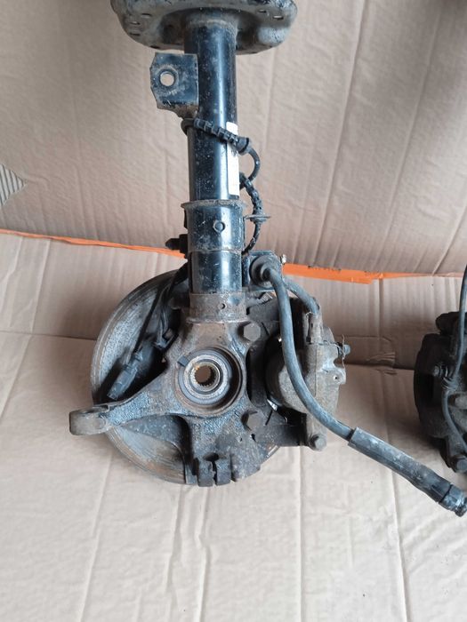 OPEL CORSA E 3D zwrotnica mcperson amortyzator piasta lewa prawa