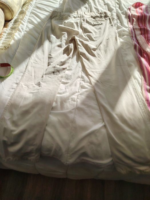 Calças cremes Lion Porsches