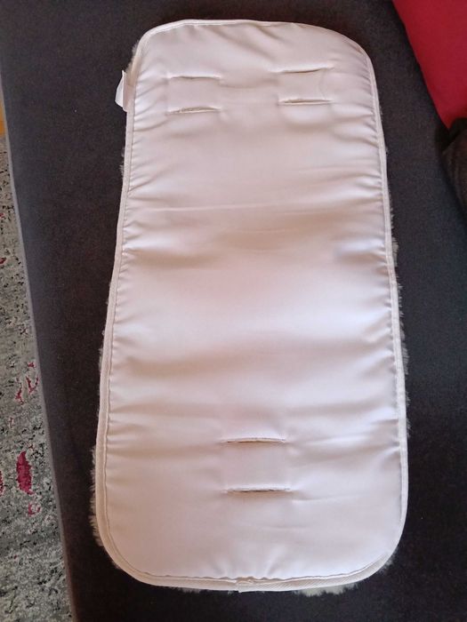 Podkład do wózka merino. Nakładka że skóry jagnięcej do wózka.