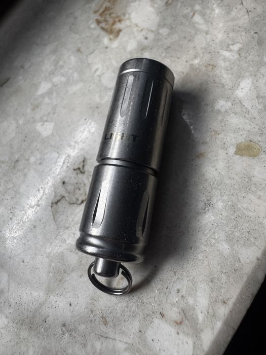Latarka  Olight  IXV  Tytan 180 lumenów