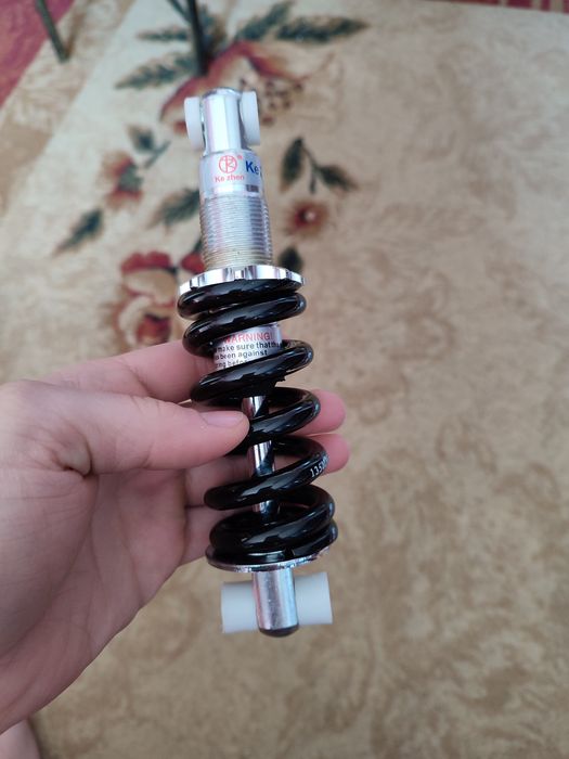 Задній амортизатор