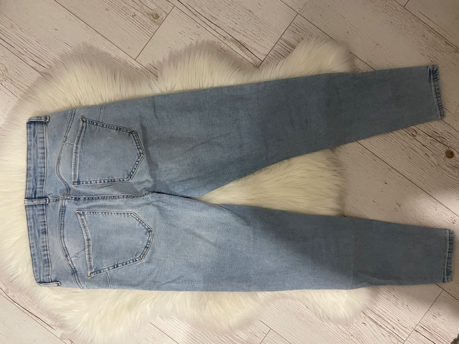 Niebieskie jeansy Reserved 40