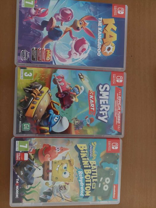 Konsola Nintendo Switch Lite (coral)+ 3 gry: Kao, Smerfy, Sponge Bob