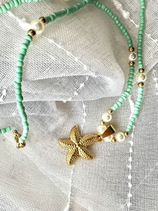 Colar em missangas com pendente