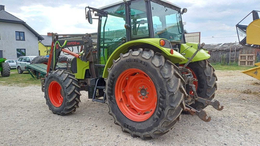 Claas Axos 320 z ładowaczem czołowym Faucheux Captor 100