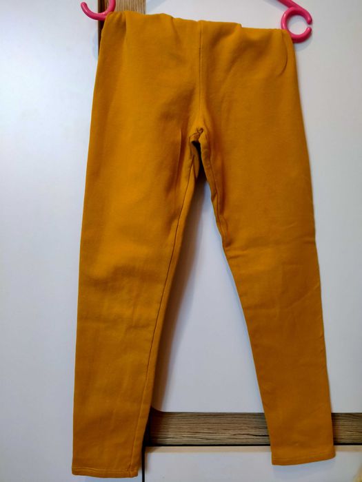 żółte spodnie z meszkiem 134 H&M