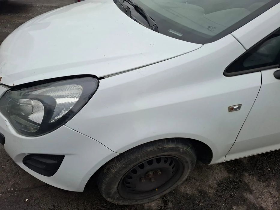 błotnik lewy przód opel corsa d lift z474