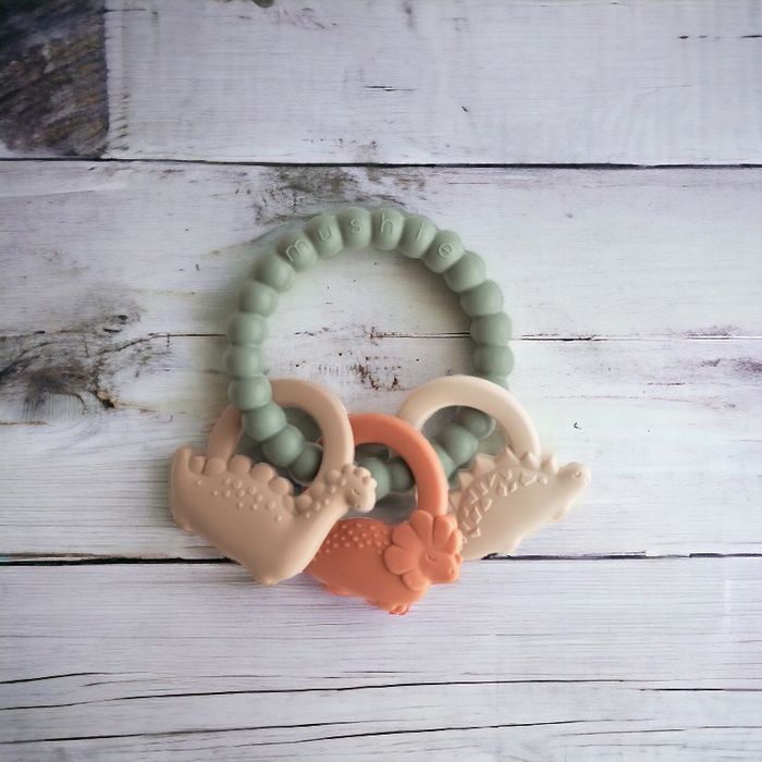 Silikonowy gryzak na kółku Dino - Mushie