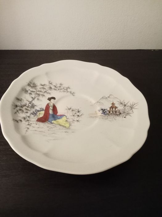 Chávena antiga de porcelana