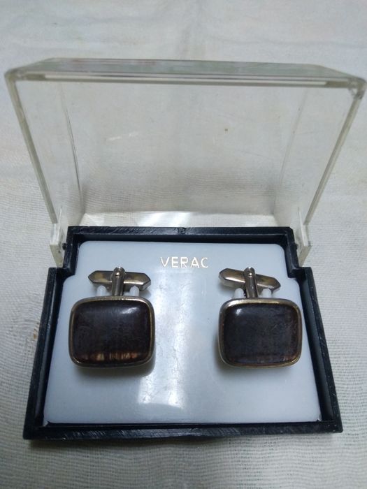 Vários botões de punhos de camisa