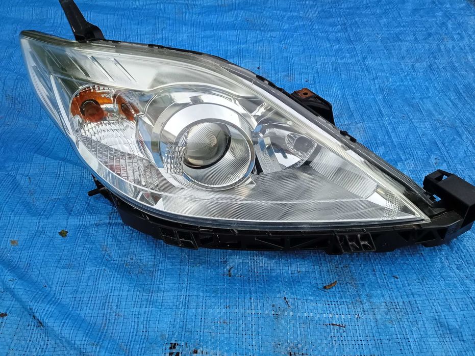 Mazda 5 Lift 08r- lampa prawy przod Org Stanley