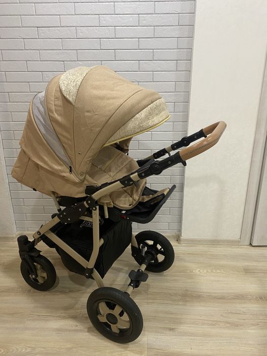 Коляска 2в1 та заколисуючий центр із розвиваючим килимком