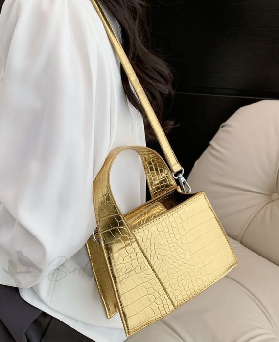 Жіноча золота сумочка