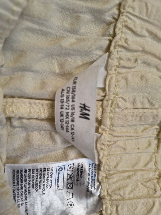 Żółte - pastelowe bawełniane spodenki 12-14 lat H&M