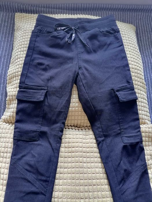 Spodnie legginsy dziewczęce czarne typu bojówki rozm 134