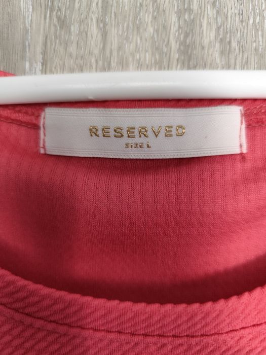 Różowa rozkloszowana sukienka Reserved L