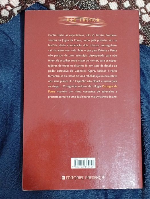 Em Chamas os jogos da fome de Suzanne  Collins