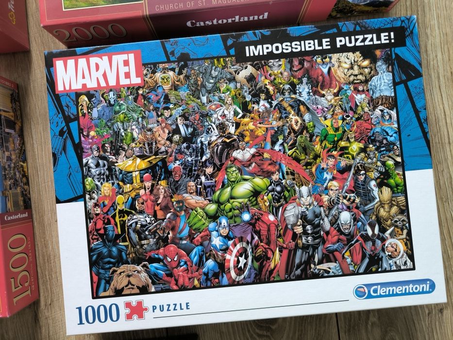 5 pudełek puzzli plus cztery antyramy do nich