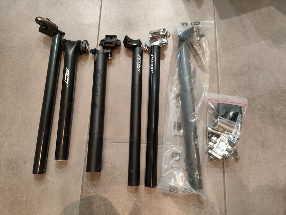 Zbiór części rowerowych: sztyce, hamulce, pedały, akcesoria