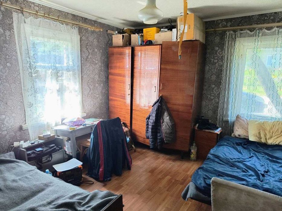 Продам 1/2 дома в центре Змиева