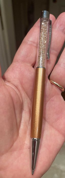 Caneta Swarowski dourada e com cristais dourados