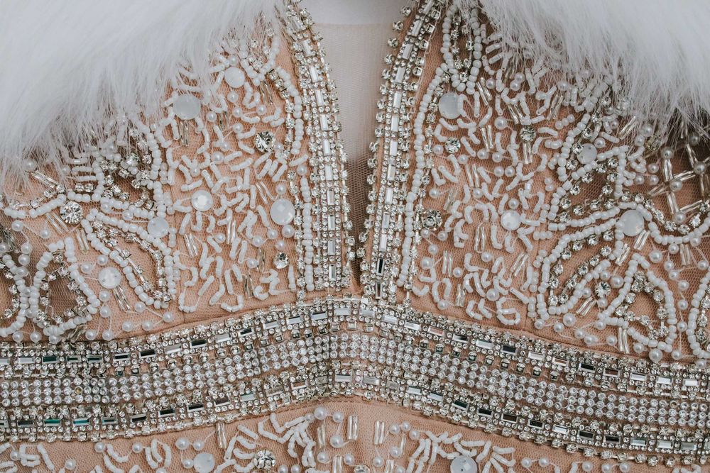 Suknia ślubna z piórkami 34-36