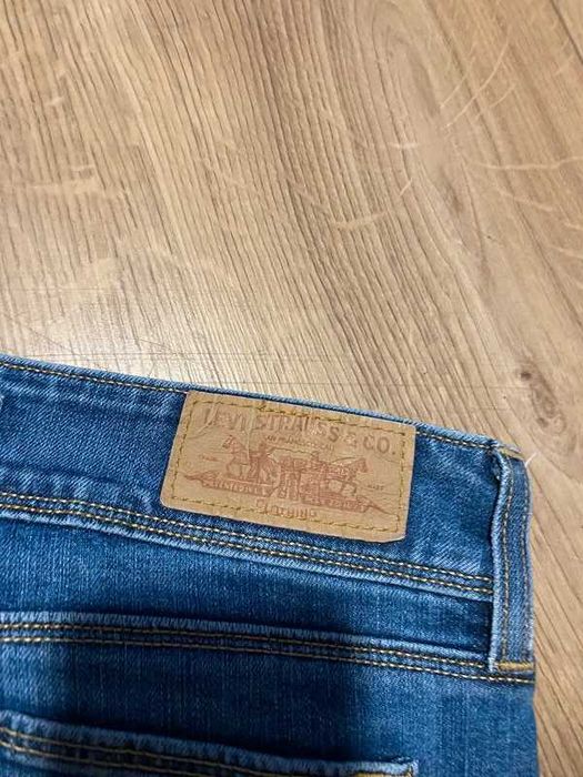 Spodnie damskie jeansowe Levis 571 slim fit niebieski denim 29x30 styl