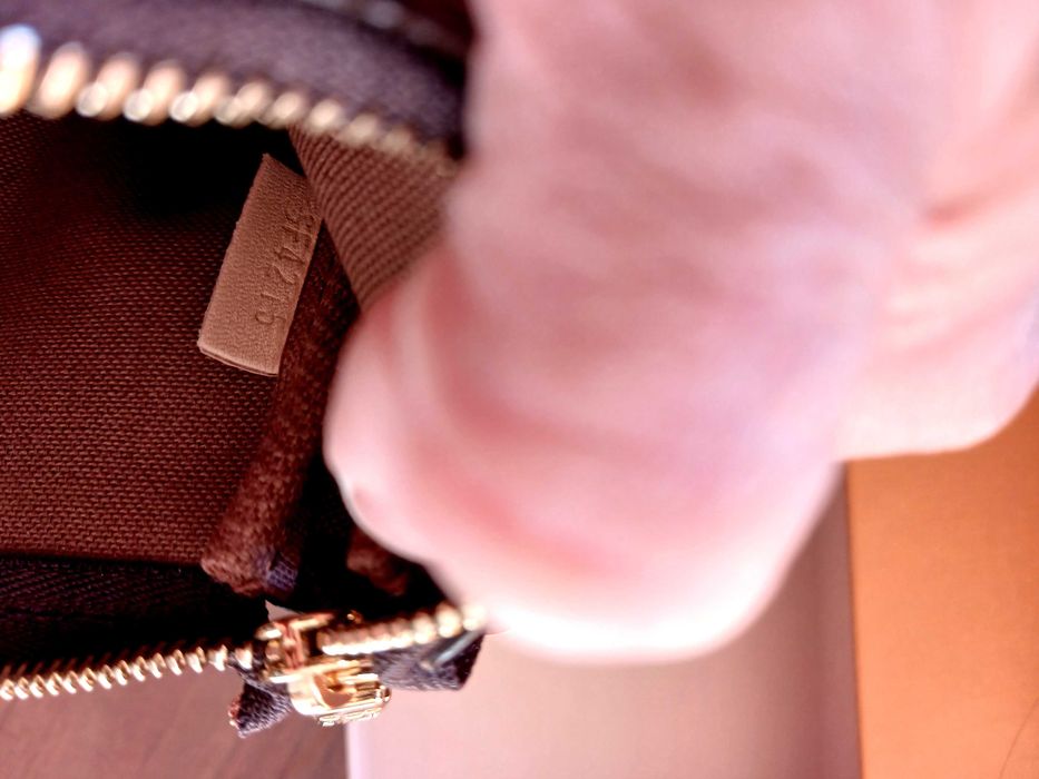 Pochette Louis Vuitton autêntica com talão de compra