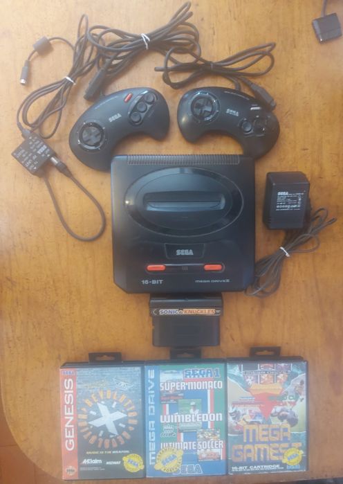 Mega drive ll com jogos e 2 comandos originais.
