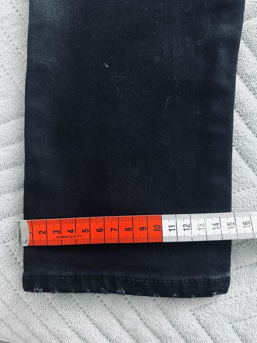 Spodnie meskie Dsquared2 czarne nakrapiane dziury