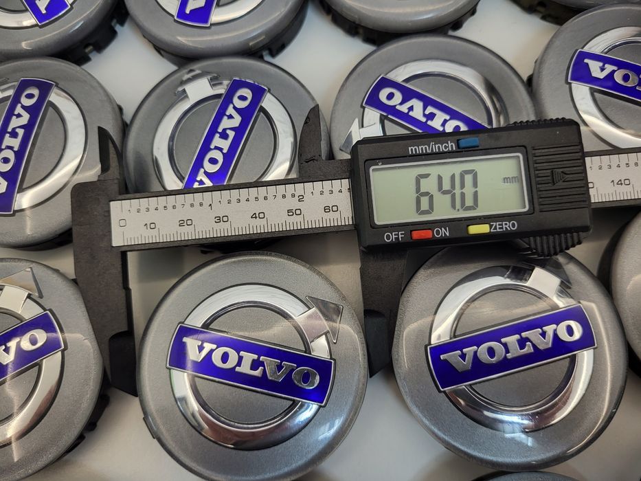 Dekle dekielki Volvo oryginal 64mm niebieski napis szare tlo