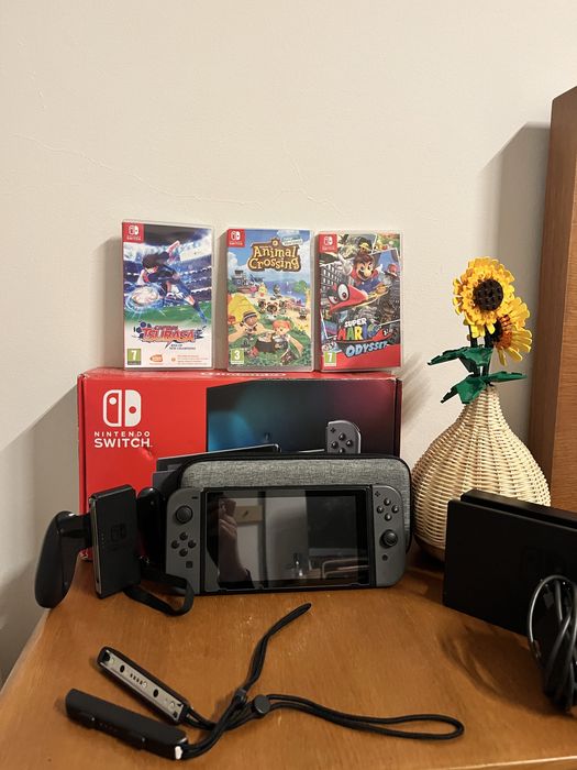 Nintendo Switch com Mario odyssey e Animal Crossing