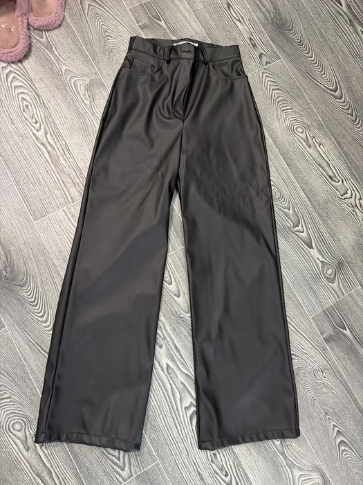 Шкіряні брюки клешоні широкі