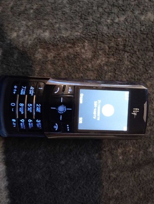 Мобільний телефон Fly SL500i  слайдер