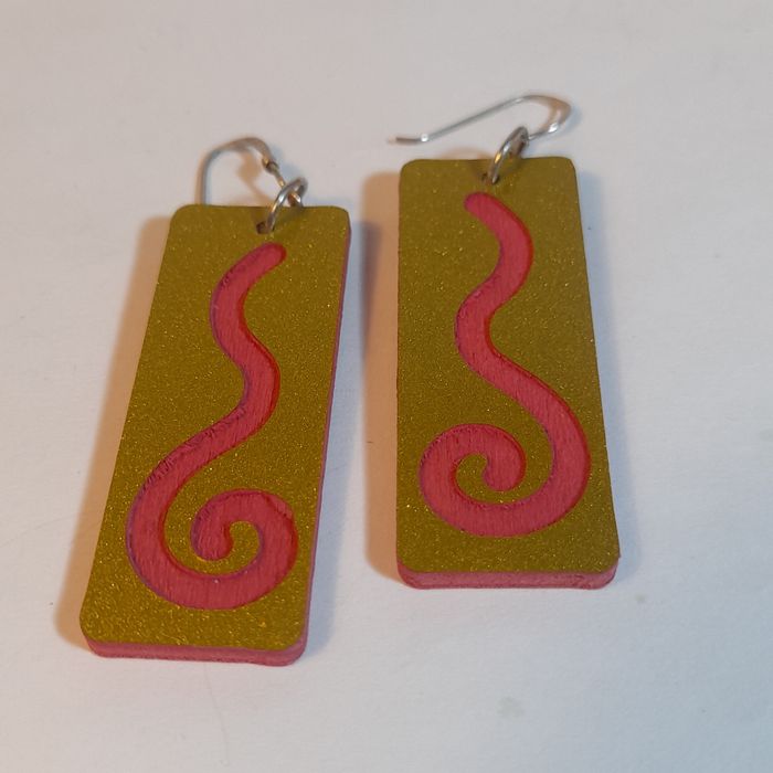 Wooden earrings with spiral design.