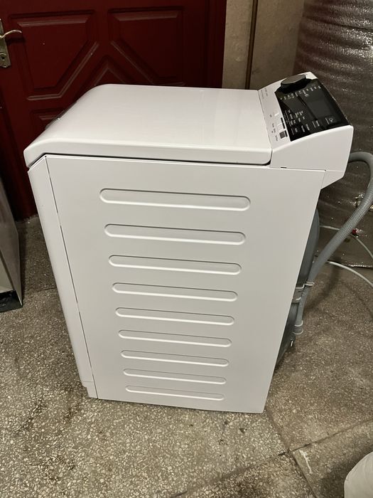 Вертикальна пральна машина AEG 7000 Series 1-7 кг