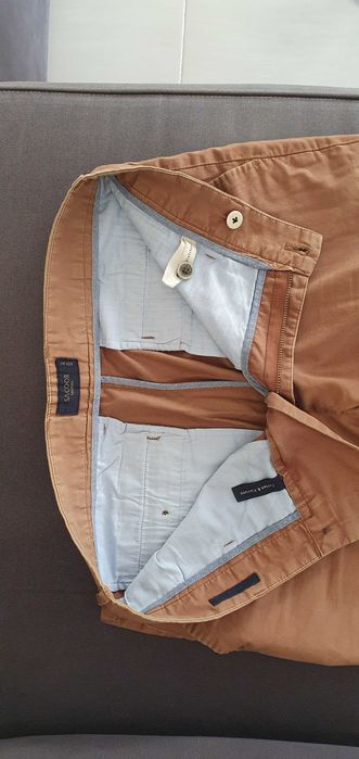 Calças Sacoor usadas com pequeno defeito