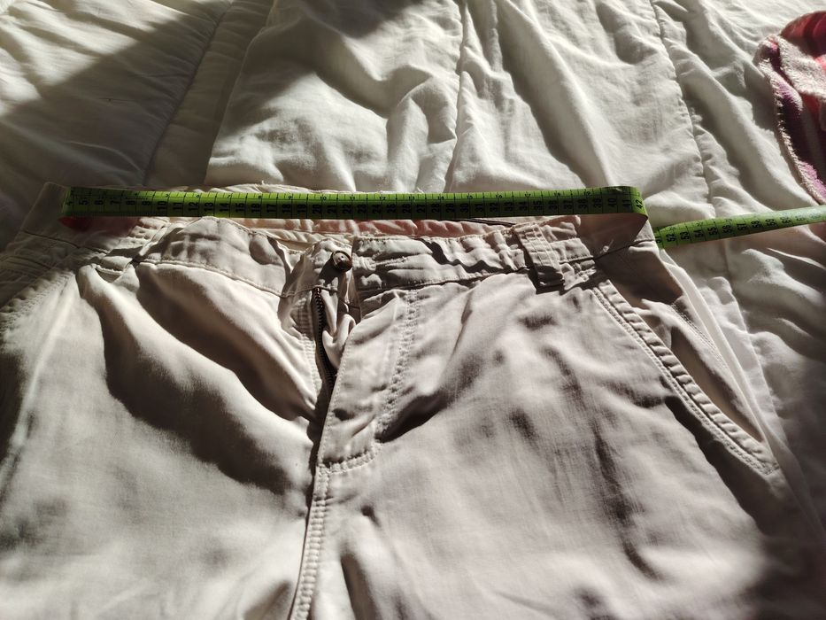 Calças cremes Lion Porsches