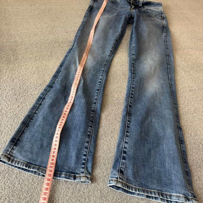 джинси кльош на низькій посадці