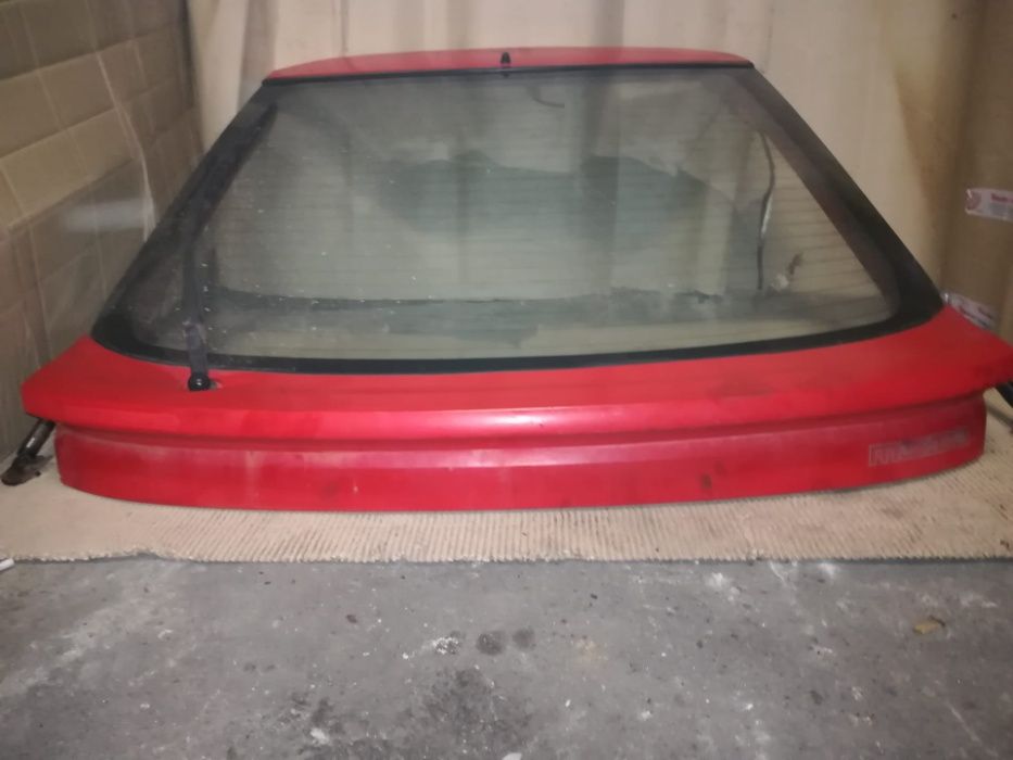 Tampa mala mazda 323