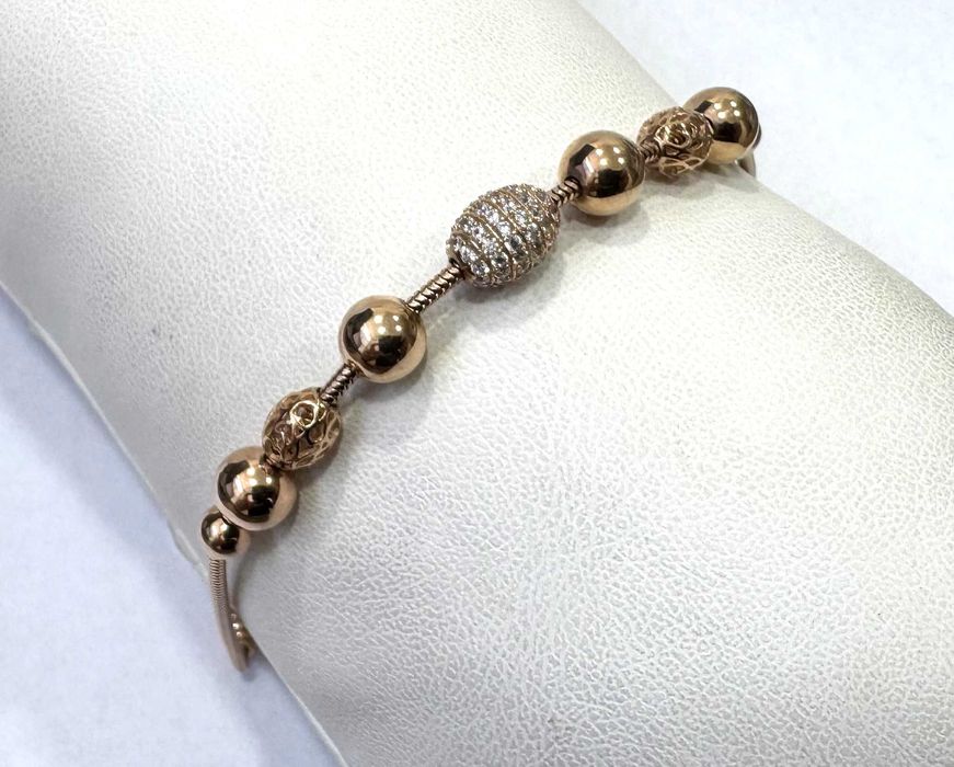 Золотий браслет оздоблений камінням