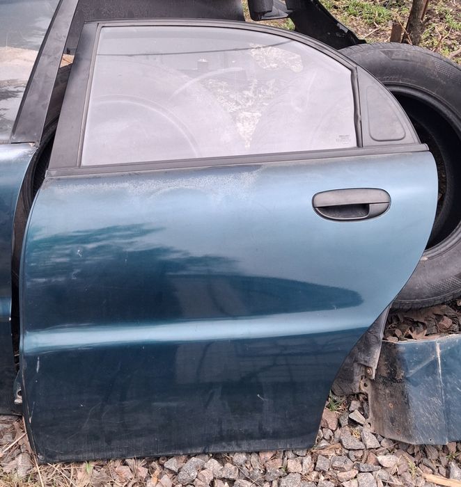 Продам  ліві  двері задні на ланос сенс