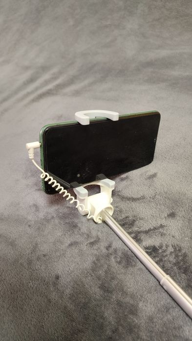 Для селфі Xiaomi Mi Bluetooth Selfie Stick. 
Легкий та міцн