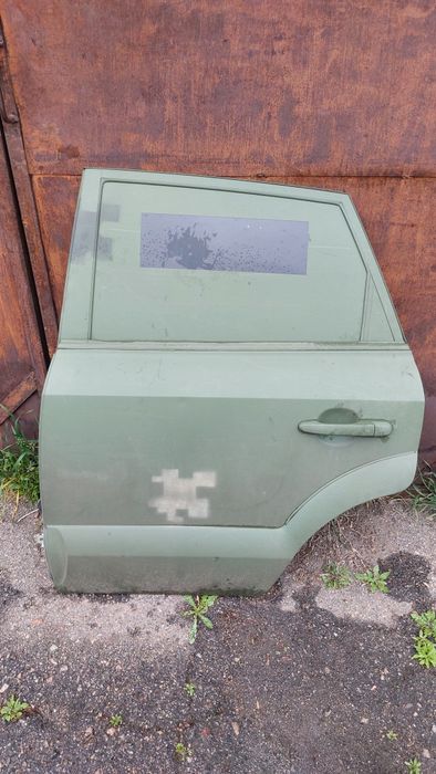 Двері задні ліві в зборі хюндай туксон 2004р.