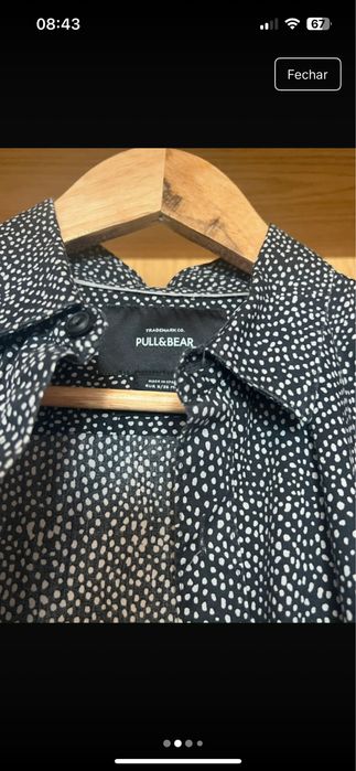 camisa preta com bolinhas